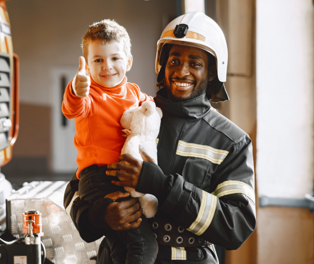 Firefighter and happy child
