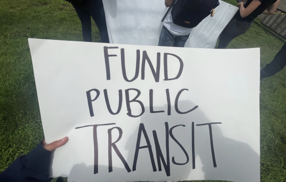 Image of a sign that says "Fund Public Transit"