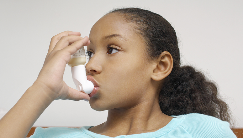 Girl using an inhaler