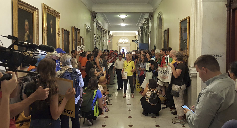 Climate and immigrants rights communities combined forces to demand real reforms outside of House Ways and Means Chairman Jeff Sanchez’s office in Massachusetts.