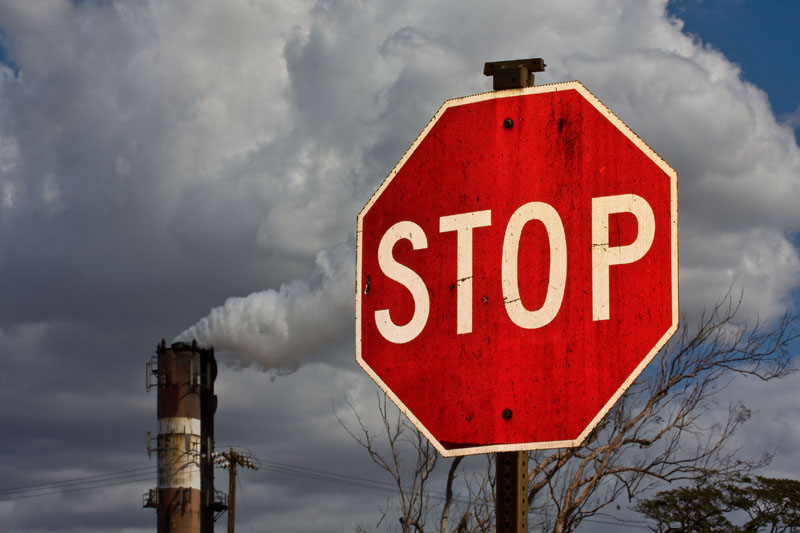 Smokestack and stop sign