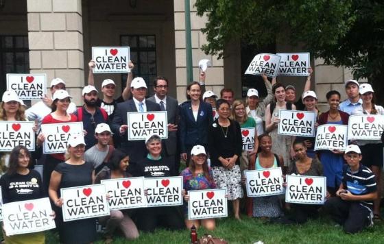 Group posing with I [Heart] Clean Water signs