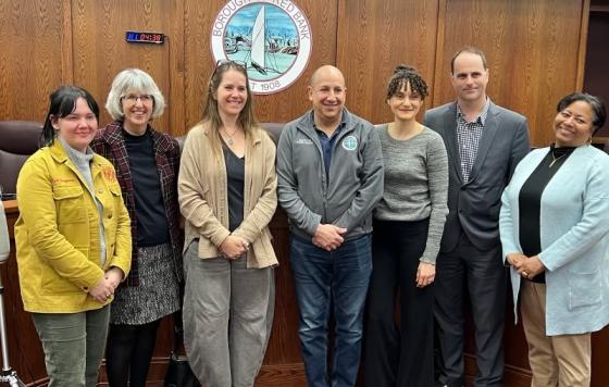 Image of Clean Water Action staff and Red Bank council passing a Skip the Stuff ordinance in Red Bank, NJ